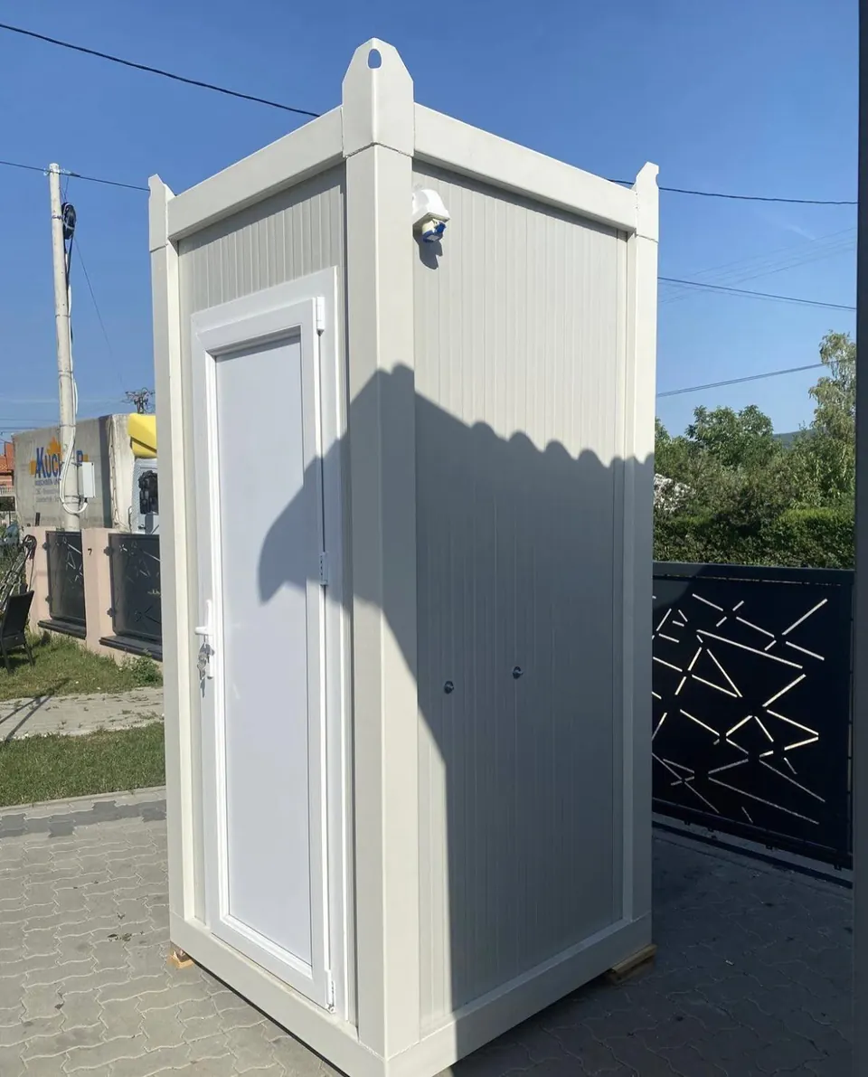 White portable restroom with ventilation near the roof