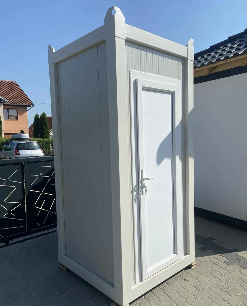 White portable restroom with an open entrance